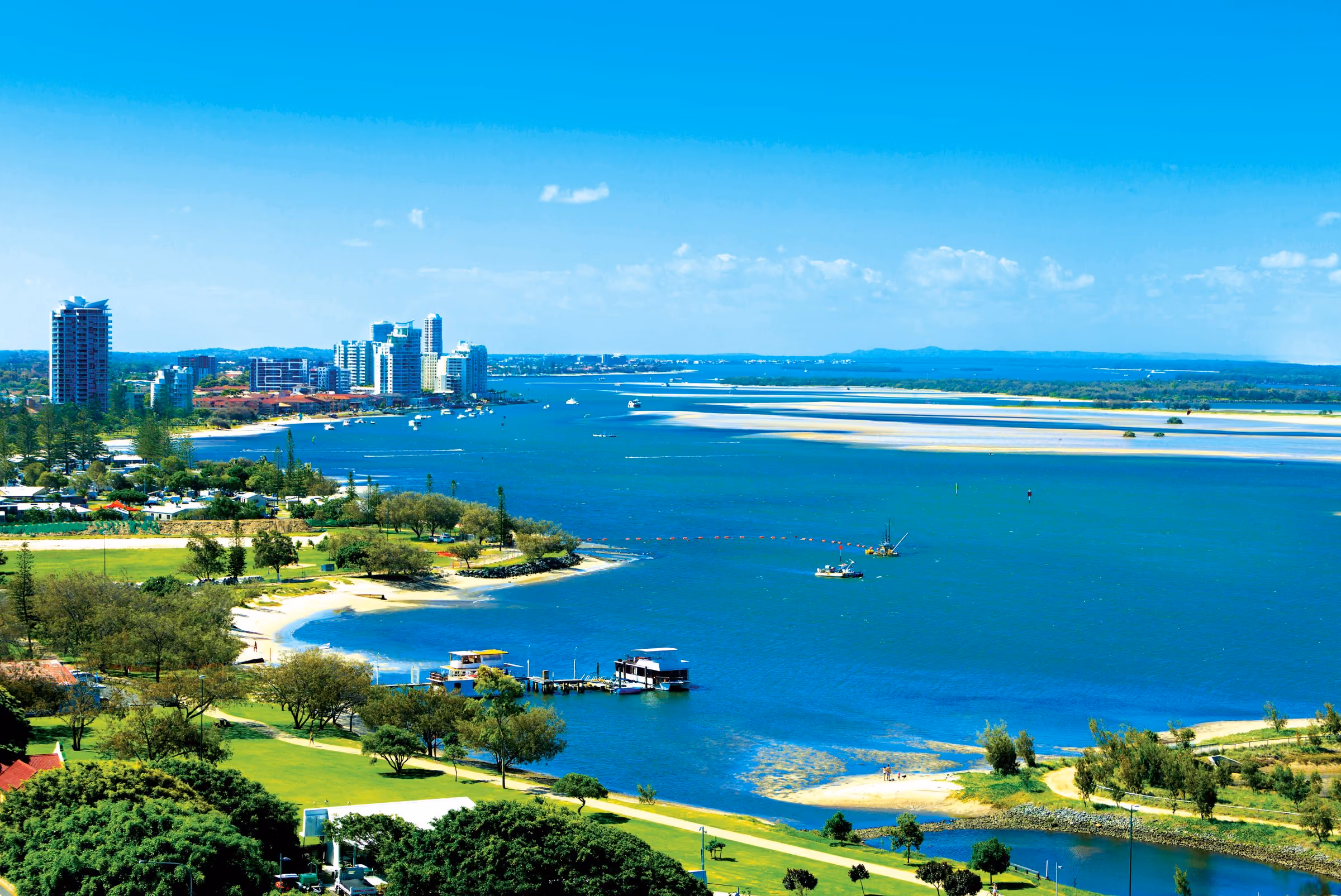 The Southport Broadwater from the air, with the Broadwater Parklands and The Henley's tower on the shore